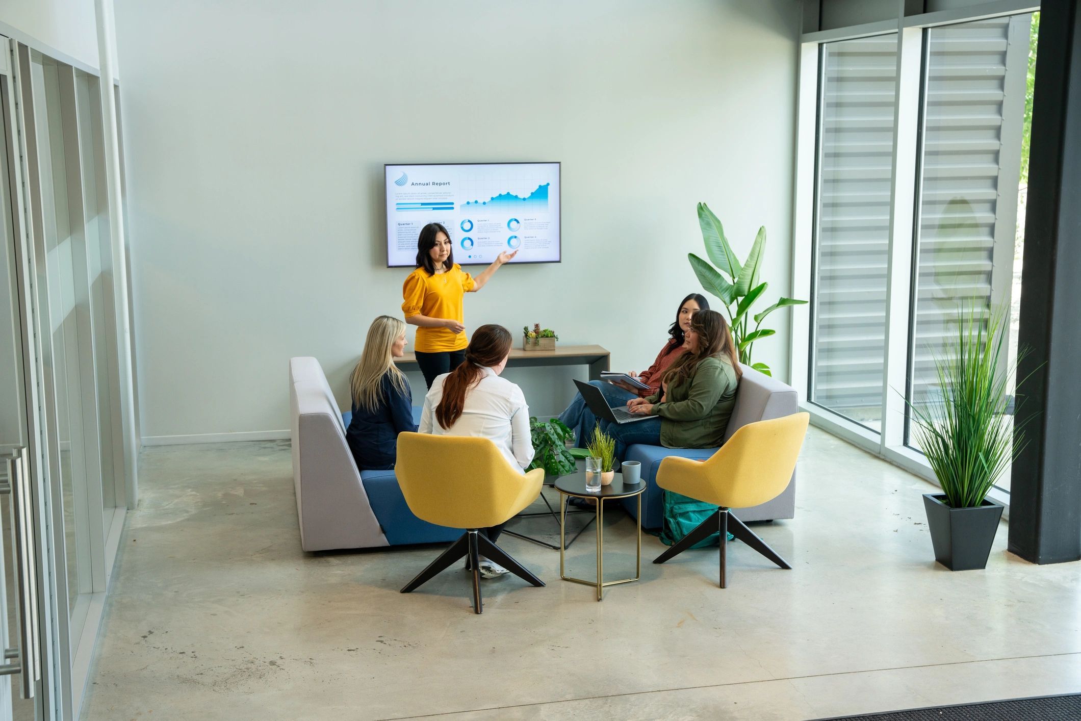 Business and technology professionals meeting in a modern office